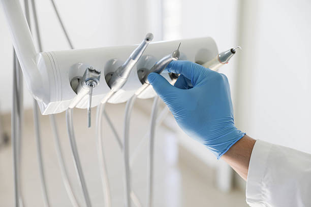 Professional Tooth Extraction technician working in Tiffin, IA
